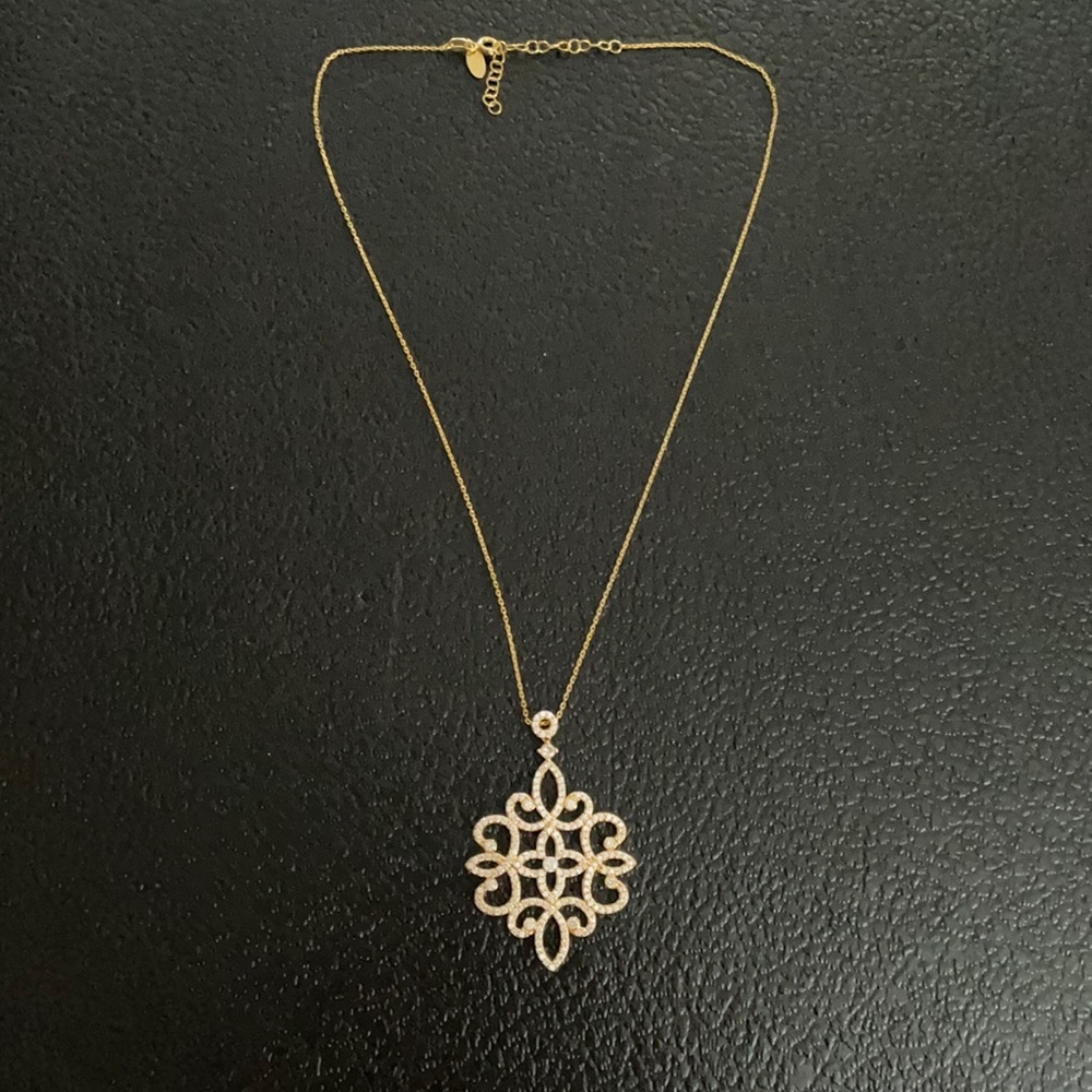 Silver necklace gold colored pendant with crystals